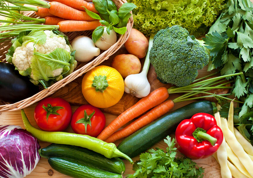 A fresh assortment of seasonal vegetables arranged on a table